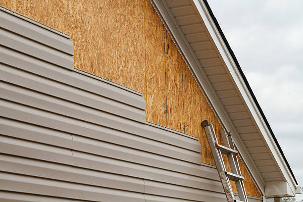 Professional Vinyl Siding technician working in Venango, PA
